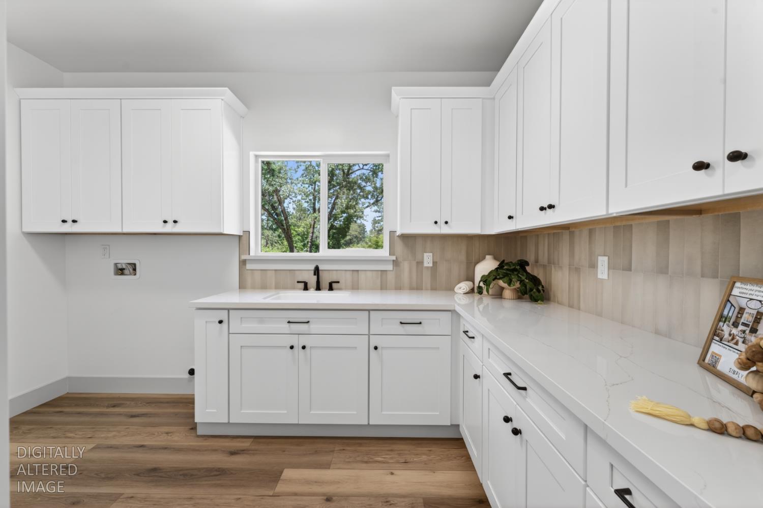 280 Jan Road Grass Valley, CA 95945 - Photo 21 of 66 a kitchen with white cabinets and a window