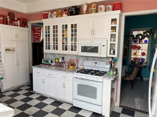 a kitchen with stainless steel appliances granite countertop a stove and a refrigerator