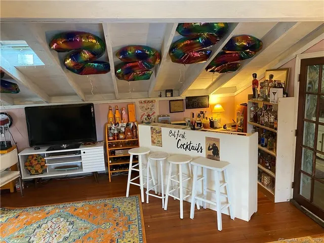 a view of a livingroom with furniture and staircase