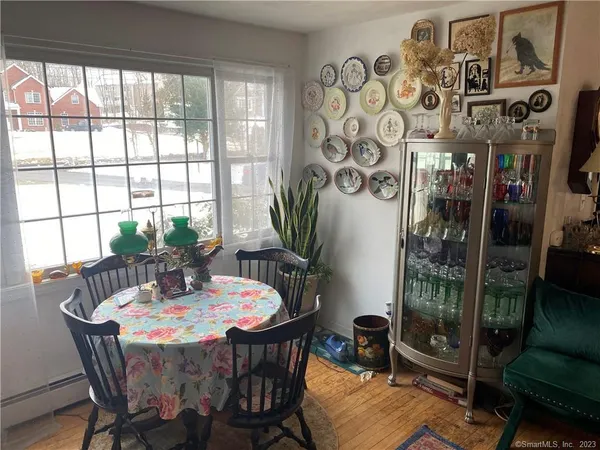 a dining room with furniture and window