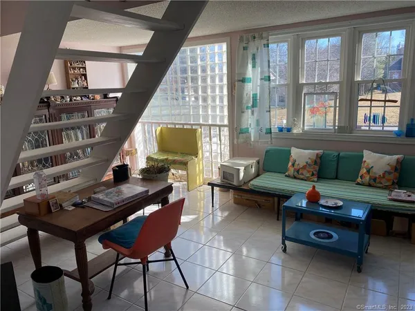 a living room with furniture and a window