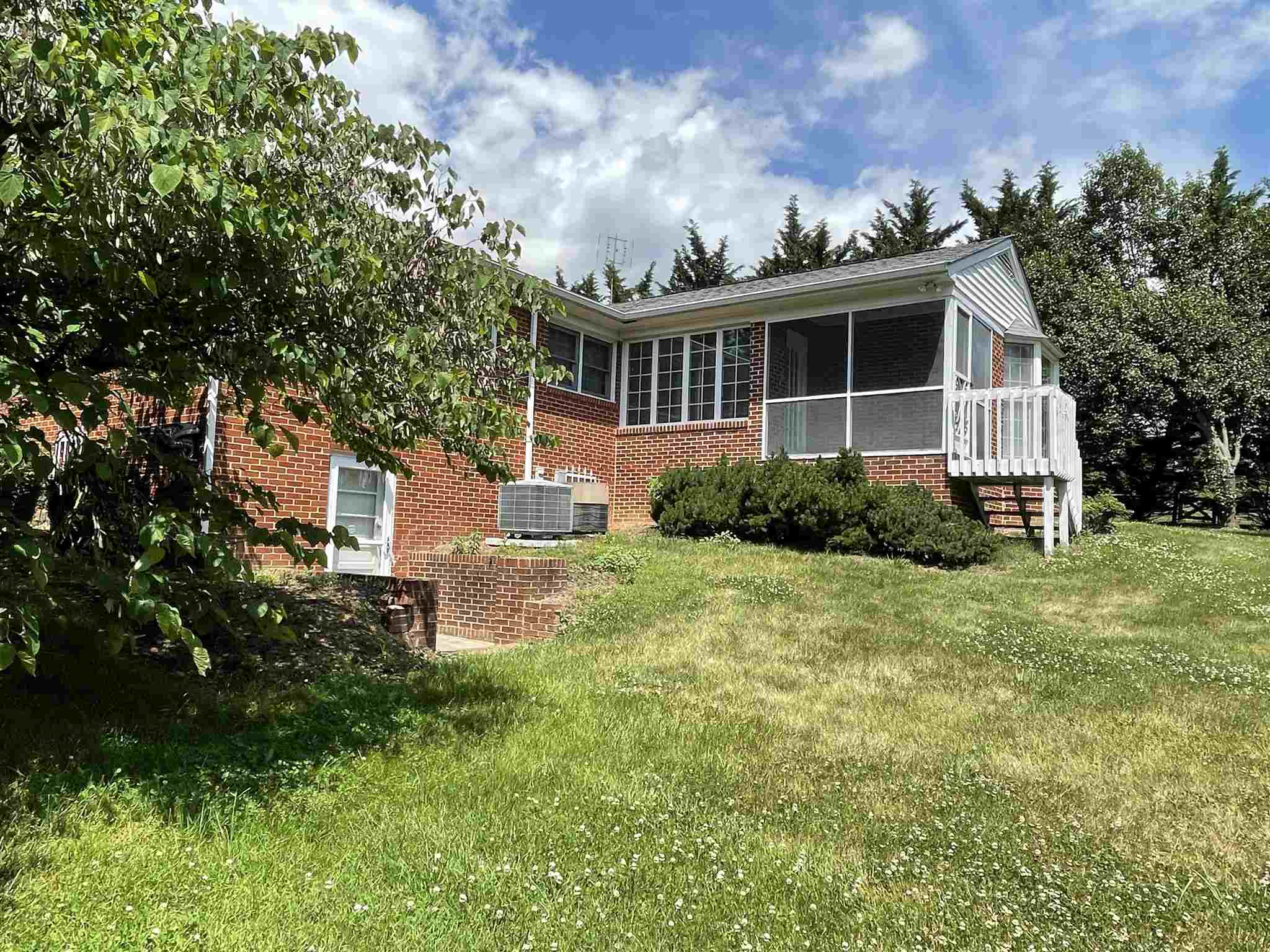 2706 Lyndhurst Road Waynesboro, VA 22980 - Photo 3 of 6 a front view of a house with garden