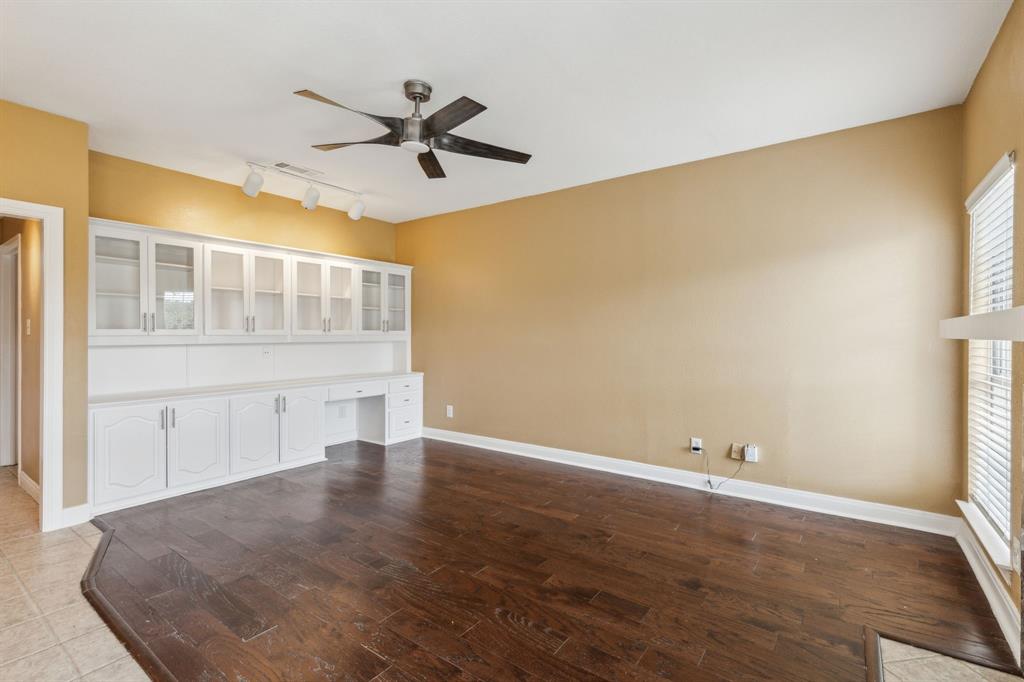 9434 Abbey Road Irving, TX 75063 - Photo 11 of 26 Family living room with built-in cabinets.