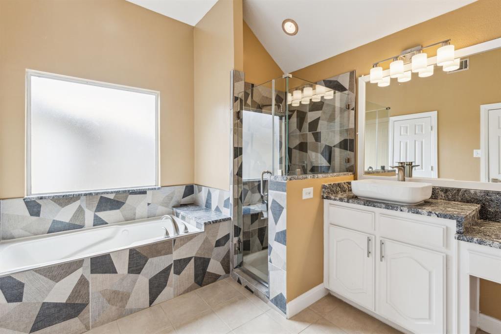 9434 Abbey Road Irving, TX 75063 - Photo 17 of 26 Master bath showcasing added shower stall