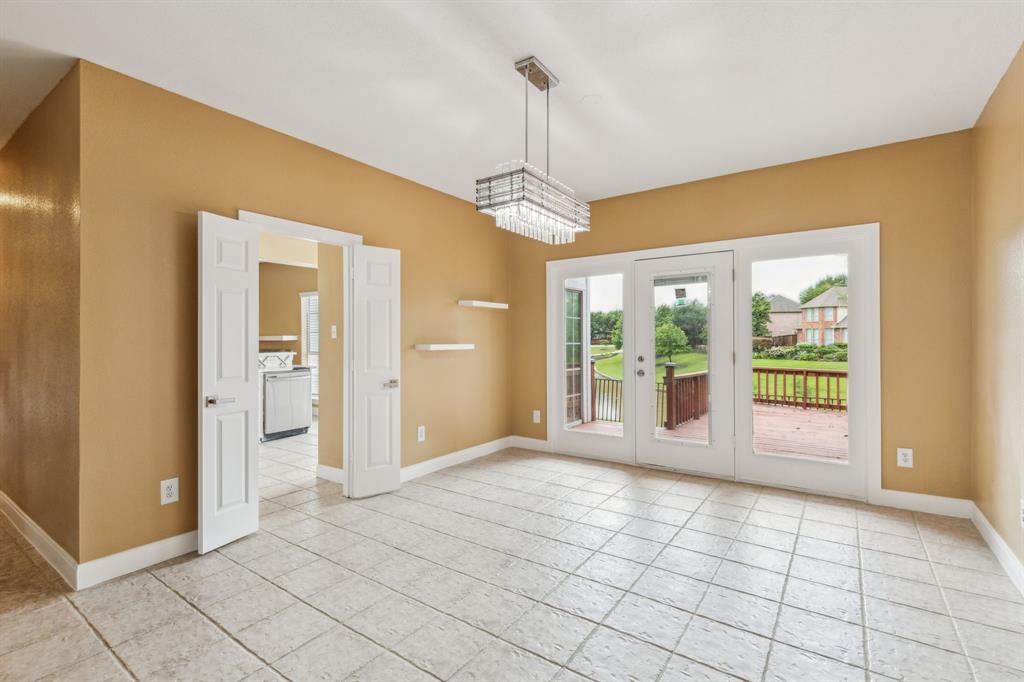 9434 Abbey Road Irving, TX 75063 - Photo 5 of 26 Formal dining opens to backyard