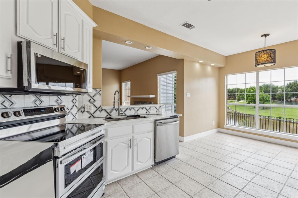 9434 Abbey Road Irving, TX 75063 - Photo 7 of 26 Enjoy beautiful canal views from Kitchen!
