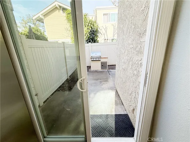 a living room with a toilet and a window