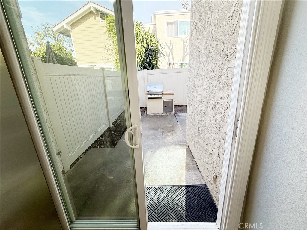 173 Oval Road, Unit 2 Irvine, CA 92604 - Photo 18 of 23 a living room with a toilet and a window