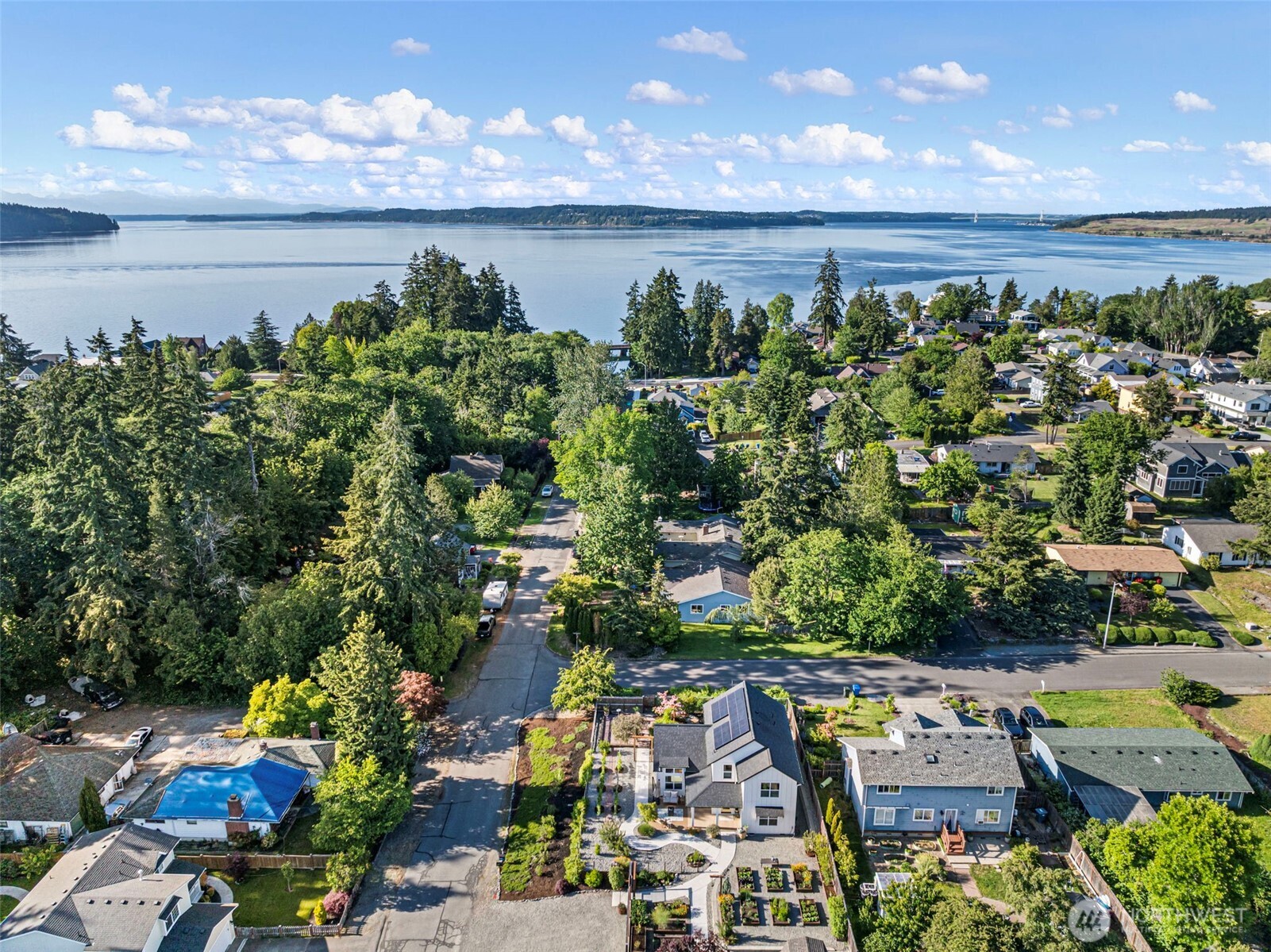 503 5th Street Steilacoom, WA 98388 - Photo 39 of 40 a view of a lake with a house