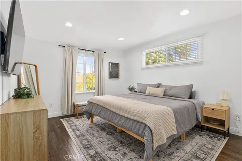 a bedroom with a large bed and a couch