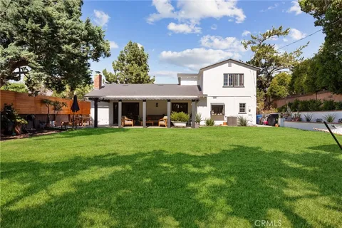 a front view of a house with a yard porch and patio