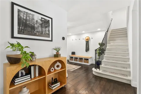 a view of an entryway with wooden floor