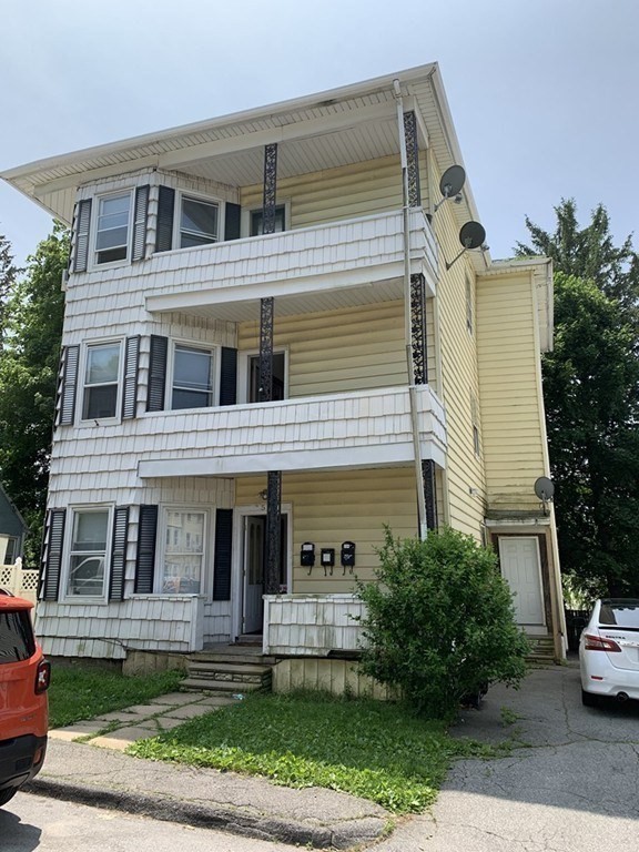 5 Rose Street Worcester, MA 01607 - Photo 1 of 30 a front view of a house with garden