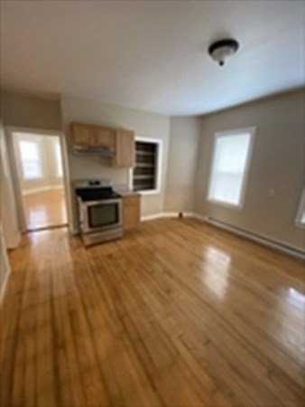 5 Rose Street Worcester, MA 01607 - Photo 21 of 30 a view of empty room with kitchen and window