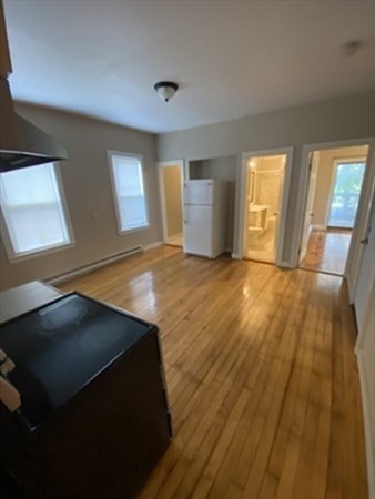 5 Rose Street Worcester, MA 01607 - Photo 26 of 30 a view of an empty room with a window and wooden floor