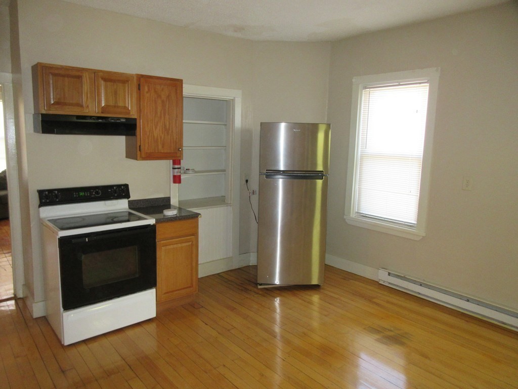 5 Rose Street Worcester, MA 01607 - Photo 4 of 30 a kitchen with a refrigerator sink and microwave