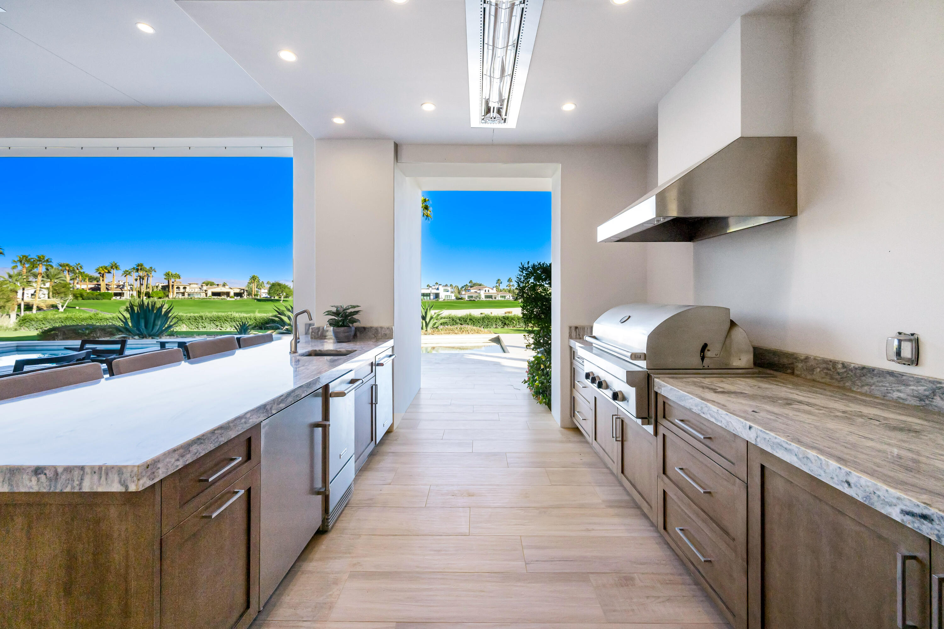 53488 Via Strada La Quinta, CA 92253 - Photo 12 of 56 a kitchen with stainless steel appliances granite countertop a stove and a sink