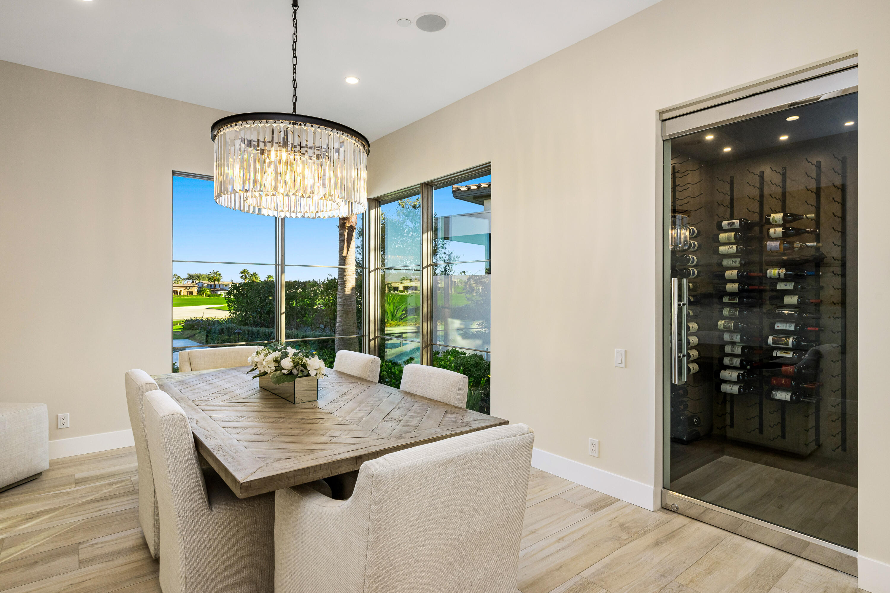 53488 Via Strada La Quinta, CA 92253 - Photo 17 of 56 a view of a dining room with a table chairs and chandelier