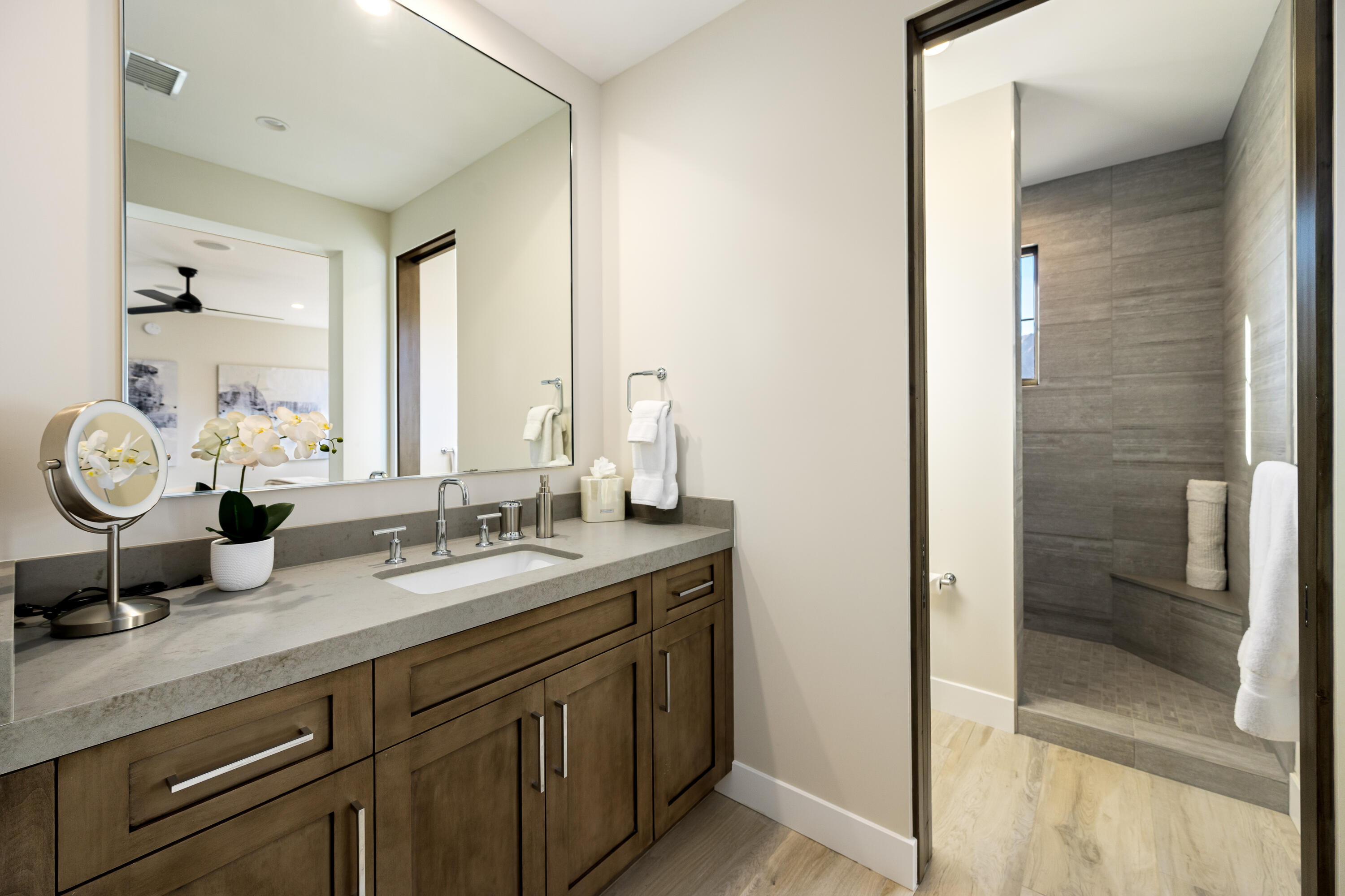 53488 Via Strada La Quinta, CA 92253 - Photo 26 of 56 a bathroom with a granite countertop sink and a mirror