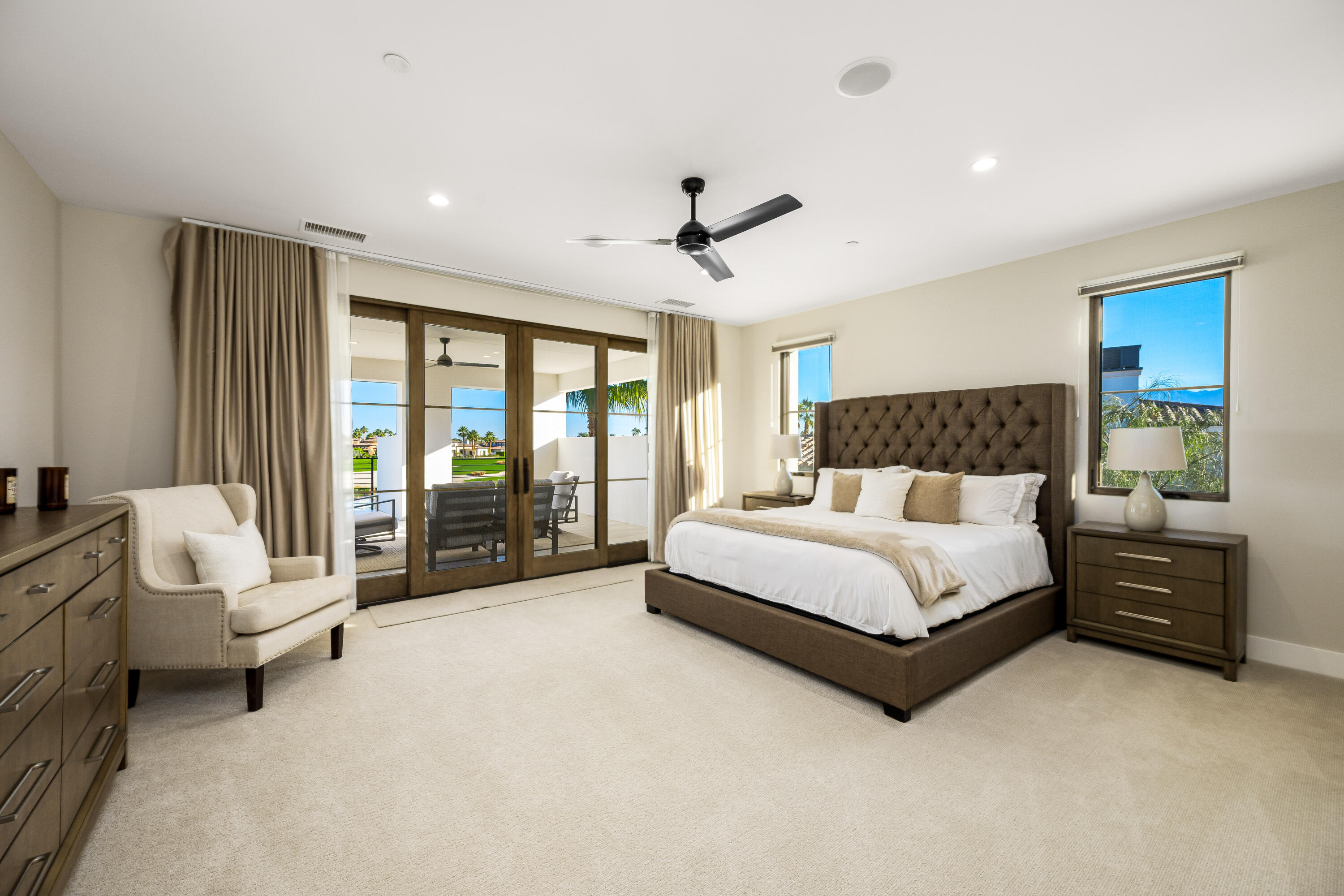 53488 Via Strada La Quinta, CA 92253 - Photo 28 of 56 a spacious bedroom with a bed and a couch