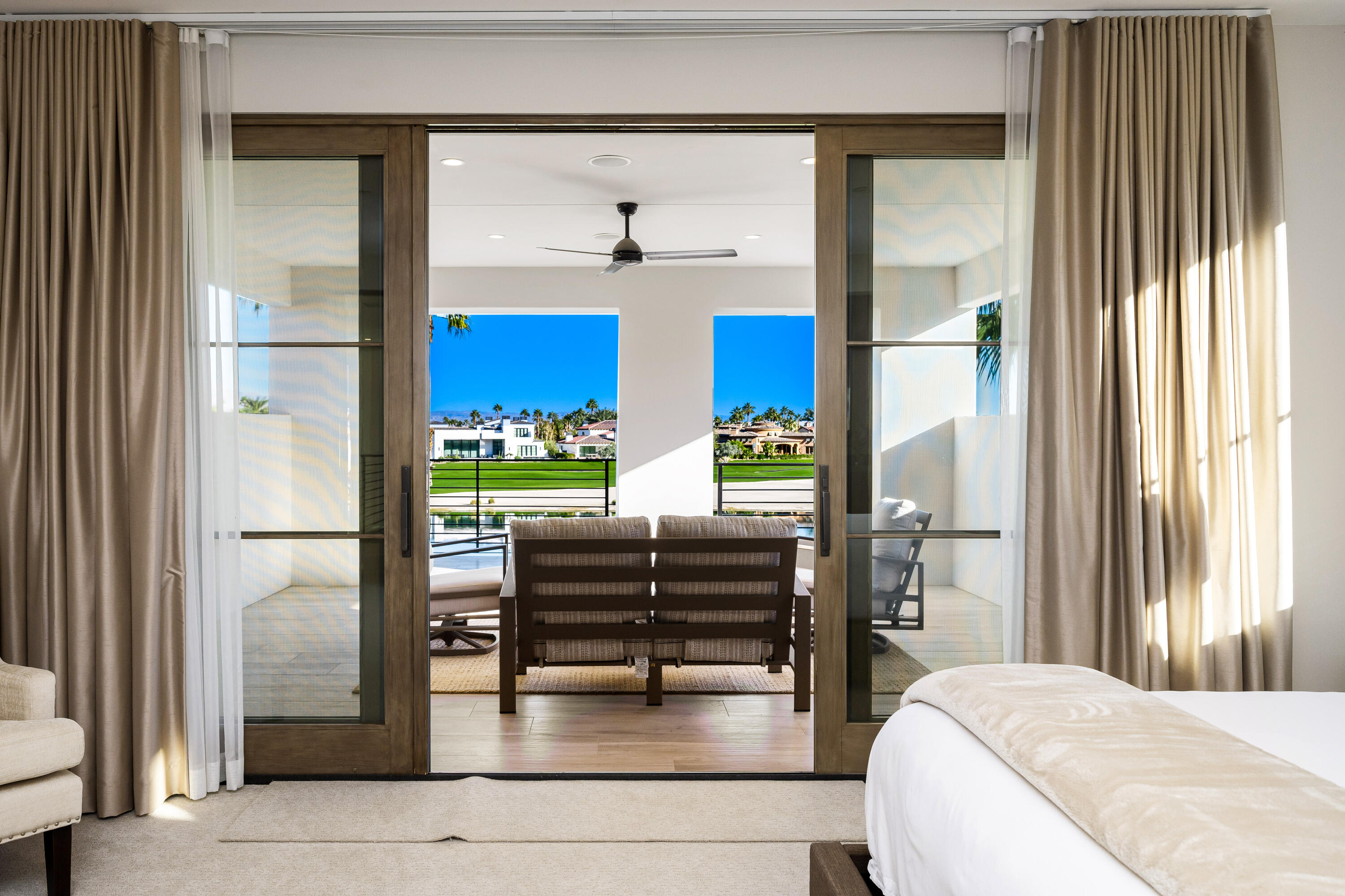 53488 Via Strada La Quinta, CA 92253 - Photo 29 of 56 a bedroom with furniture and a window