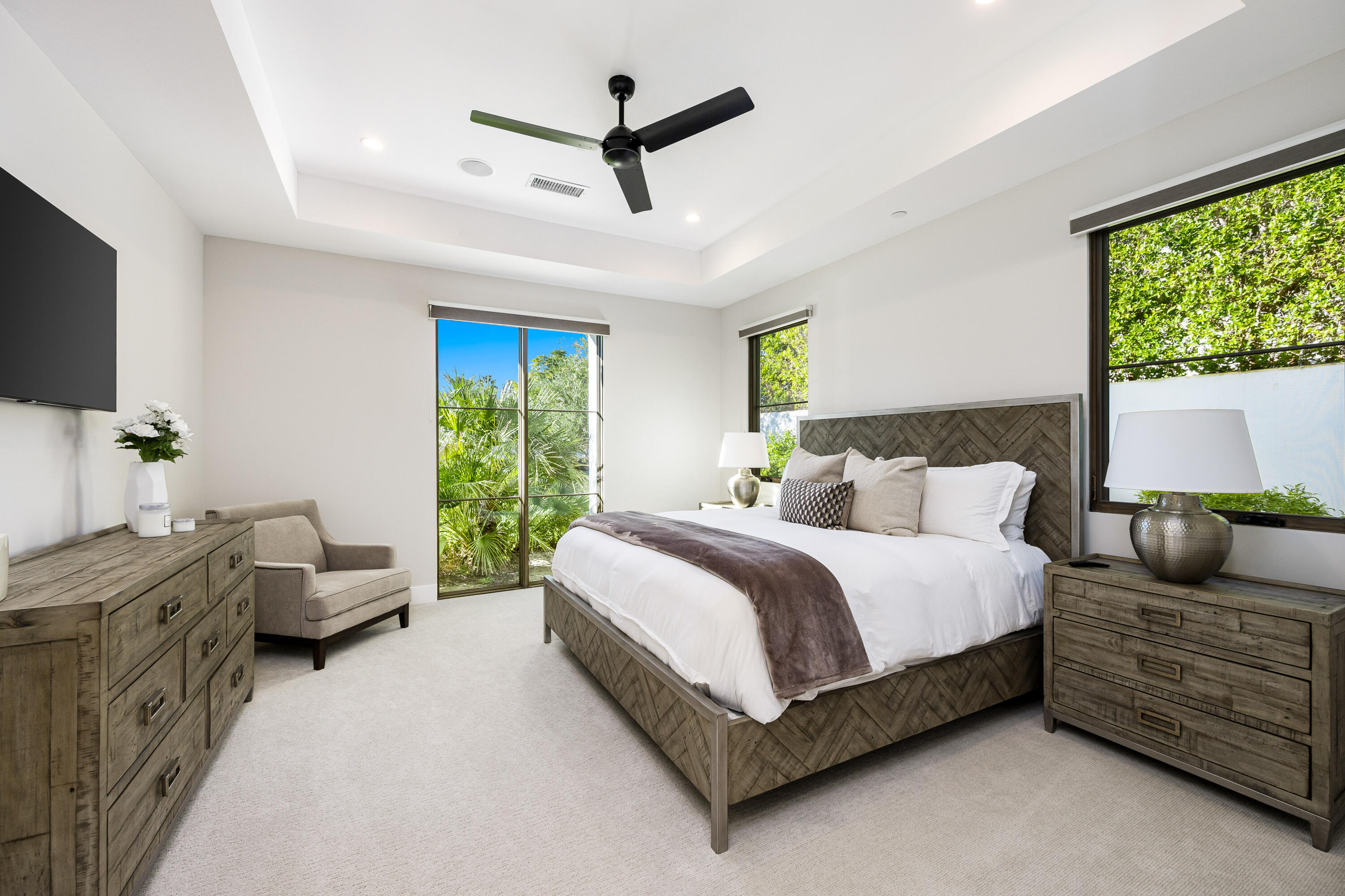 53488 Via Strada La Quinta, CA 92253 - Photo 34 of 56 a spacious bedroom with a bed and a couch