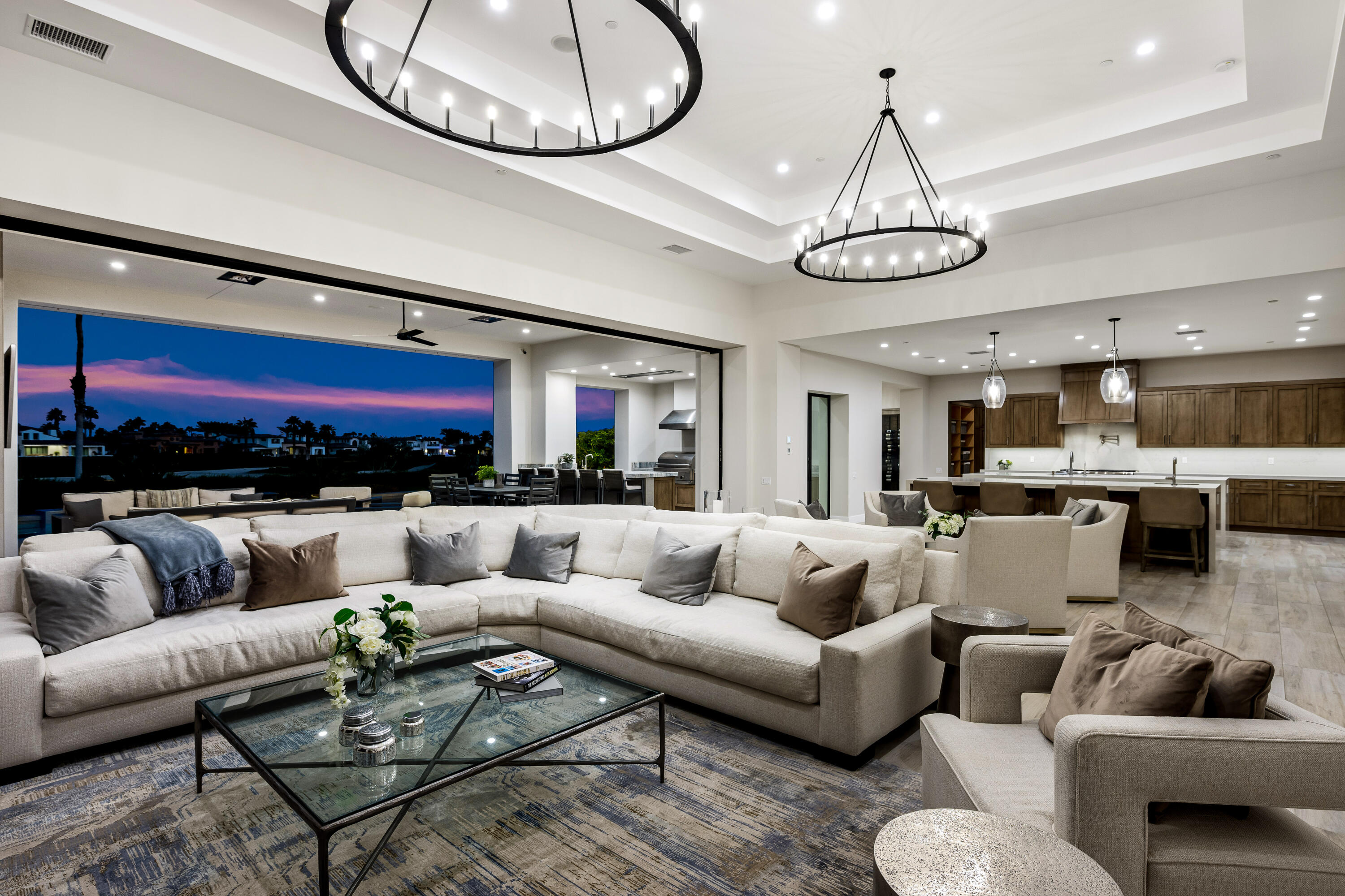 53488 Via Strada La Quinta, CA 92253 - Photo 43 of 56 a living room with furniture a rug and kitchen view