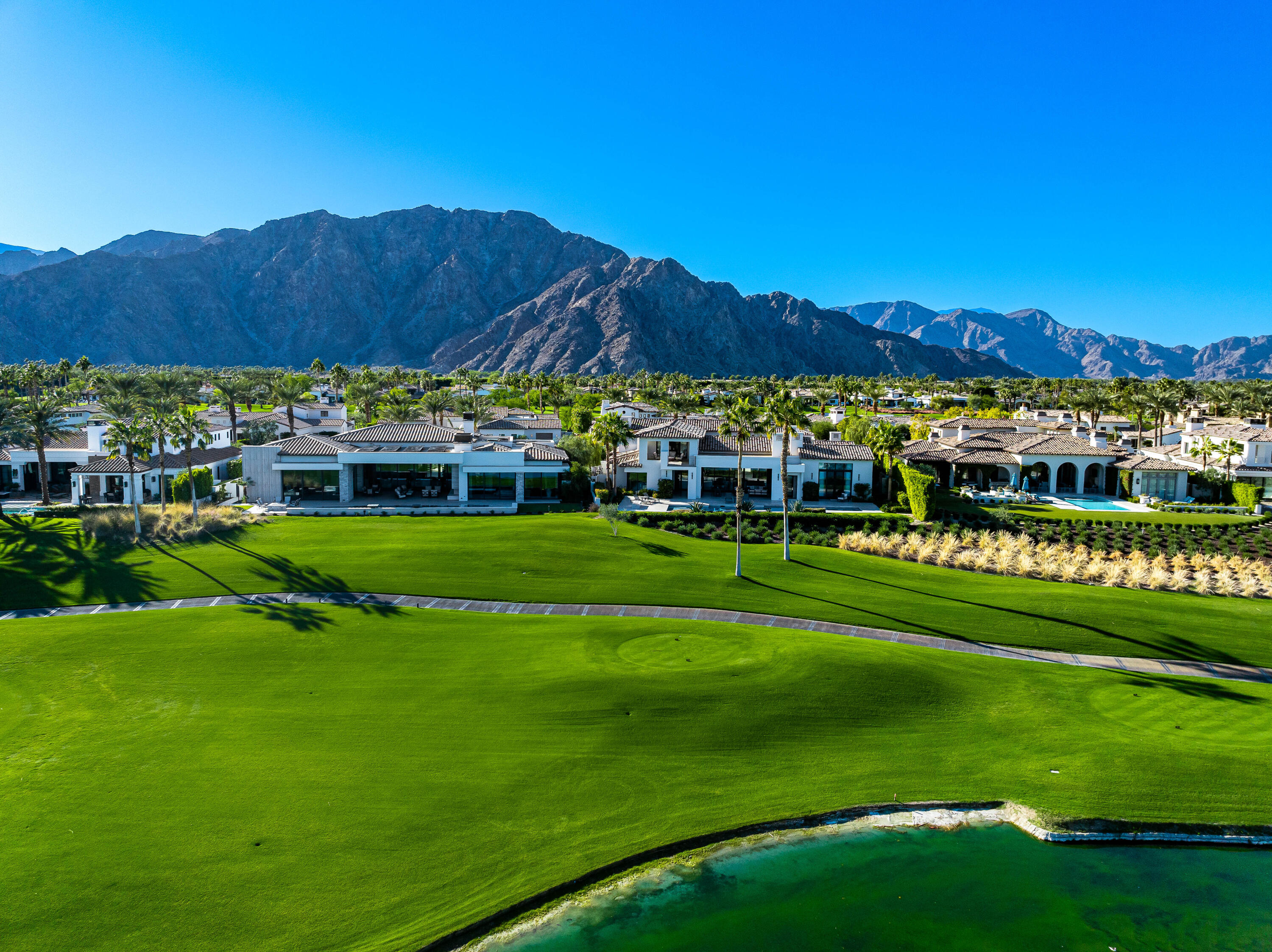 53488 Via Strada La Quinta, CA 92253 - Photo 56 of 56 a view of a lush green field with houses in the background