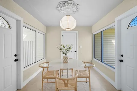a dining room with furniture and window