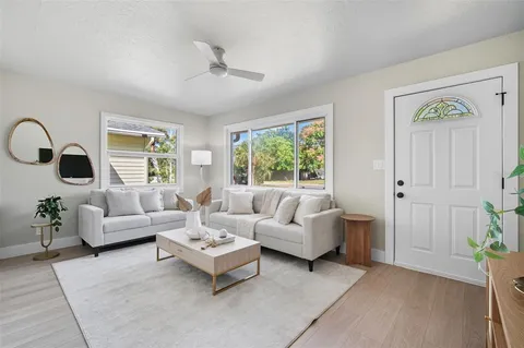 a living room with furniture and a window