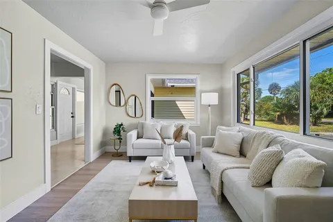 a living room with furniture and a large window