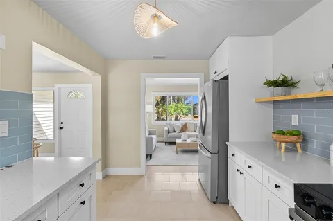 a spacious en suite bathroom with a granite countertop sink