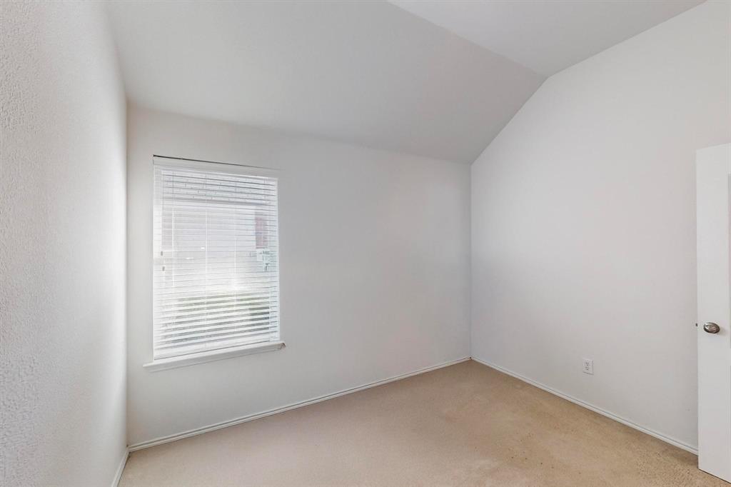 7544 Fresh Springs Road Fort Worth, TX 76120 - Photo 11 of 16 an empty room with a window