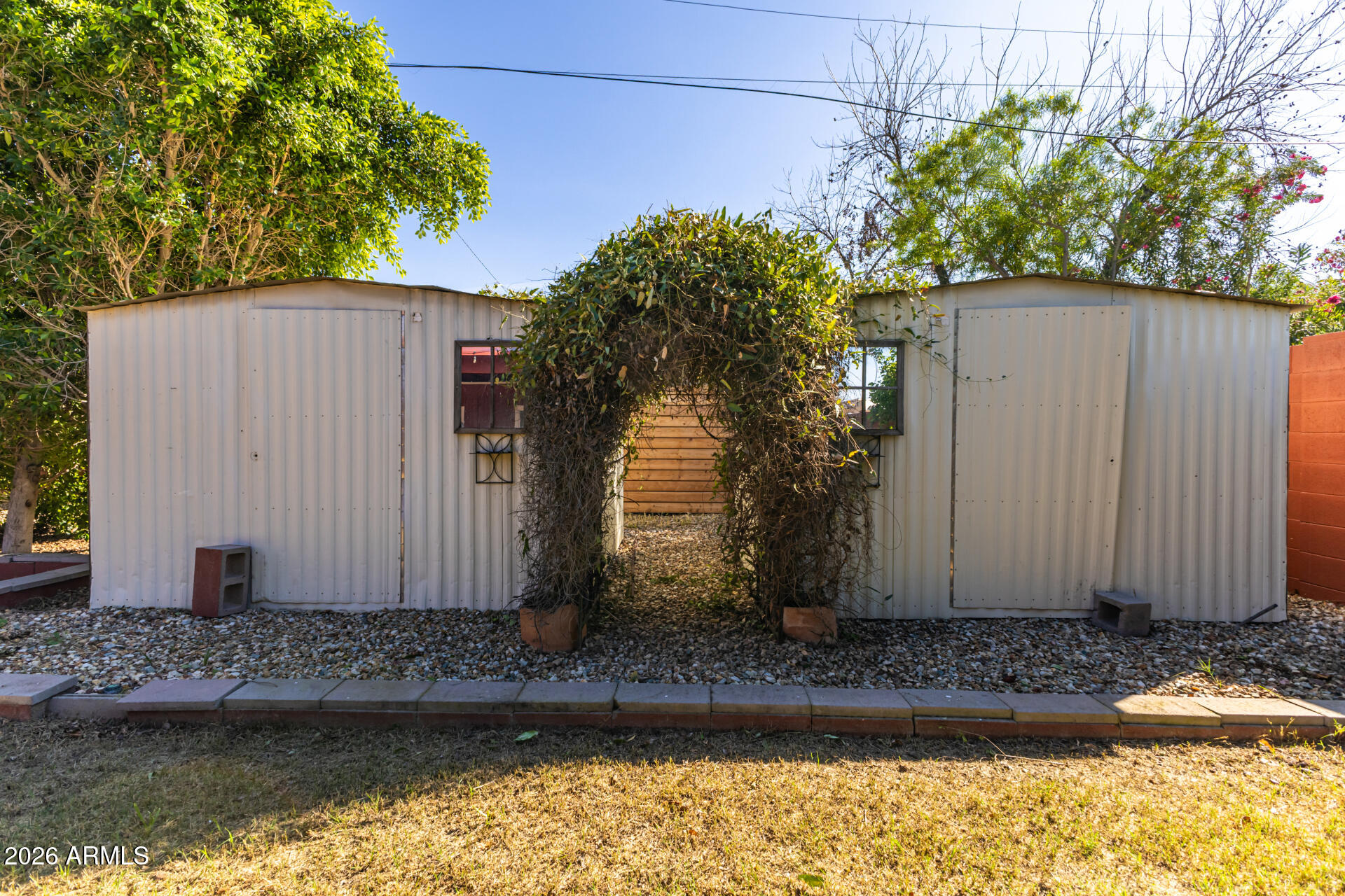 1307 West Thomas Road Phoenix, AZ 85007 - Photo 31 of 35 a view of a house with a yard plants and large tree