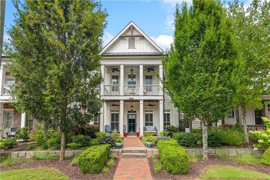 126 Academy Street Alpharetta, GA 30009 - Photo 1 of 74 a front view of a house with yard and green space
