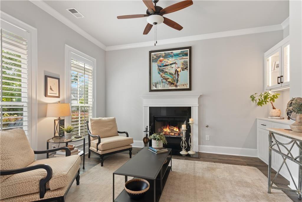 126 Academy Street Alpharetta, GA 30009 - Photo 15 of 74 a living room with furniture and a fireplace