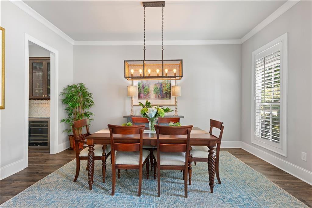 126 Academy Street Alpharetta, GA 30009 - Photo 17 of 74 a view of a dining room with furniture window and wooden floor