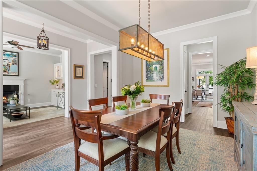 126 Academy Street Alpharetta, GA 30009 - Photo 19 of 74 a view of a dining room with furniture window and wooden floor