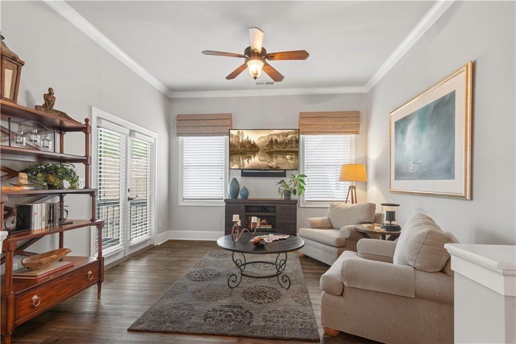 126 Academy Street Alpharetta, GA 30009 - Photo 36 of 74 a living room with furniture a rug and a large window