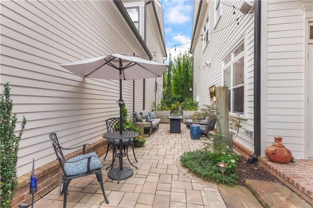 126 Academy Street Alpharetta, GA 30009 - Photo 64 of 74 a view of a chairs and table in the patio