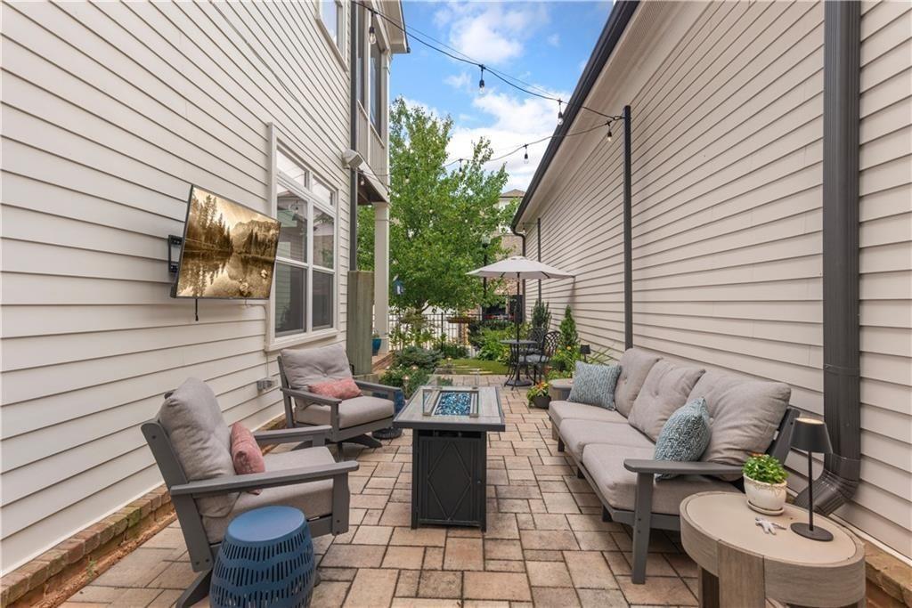 126 Academy Street Alpharetta, GA 30009 - Photo 65 of 74 a view of a patio with couches chairs and a potted plant