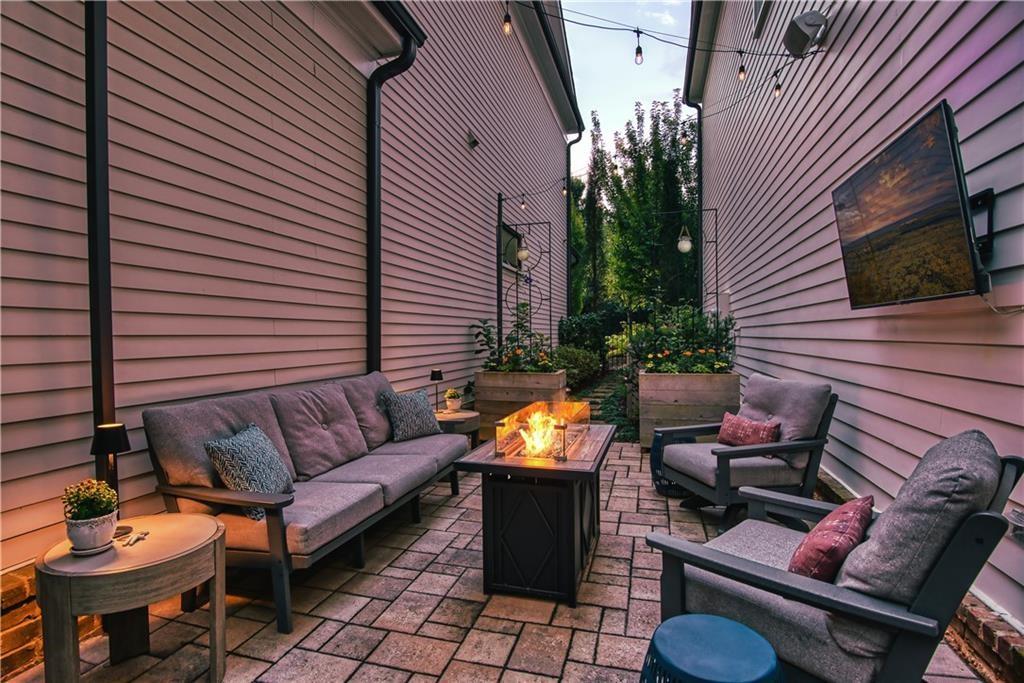 126 Academy Street Alpharetta, GA 30009 - Photo 70 of 74 a view of a patio with couches chairs and a fire pit