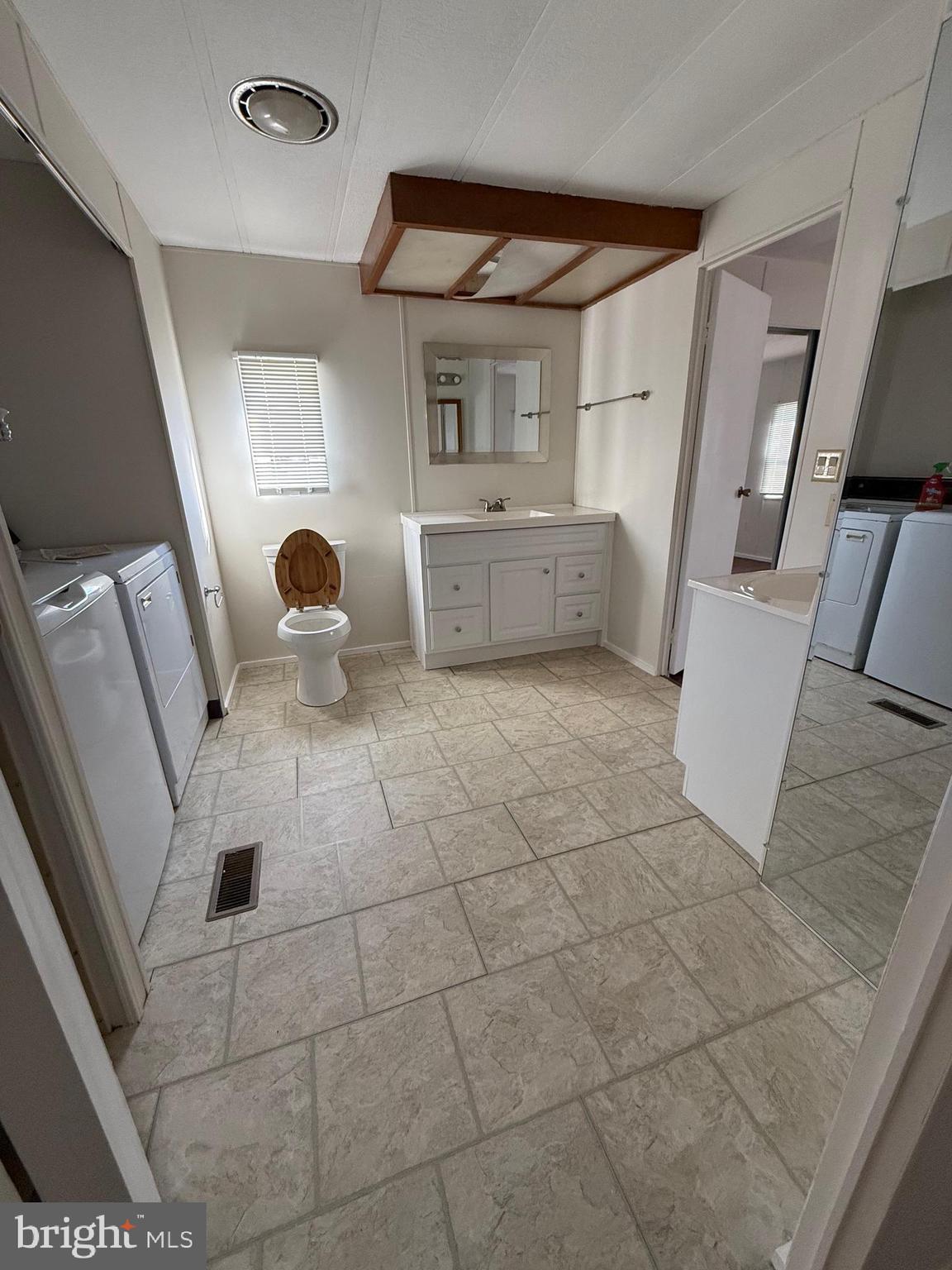 6095 Chan Place La Plata, MD 20646 - Photo 6 of 9 a kitchen with a sink a stove and cabinets