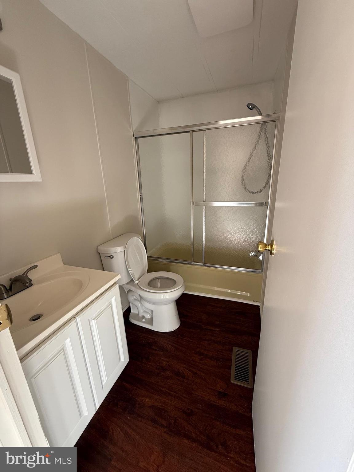 6095 Chan Place La Plata, MD 20646 - Photo 8 of 9 a bathroom with a sink mirror vanity and toilet