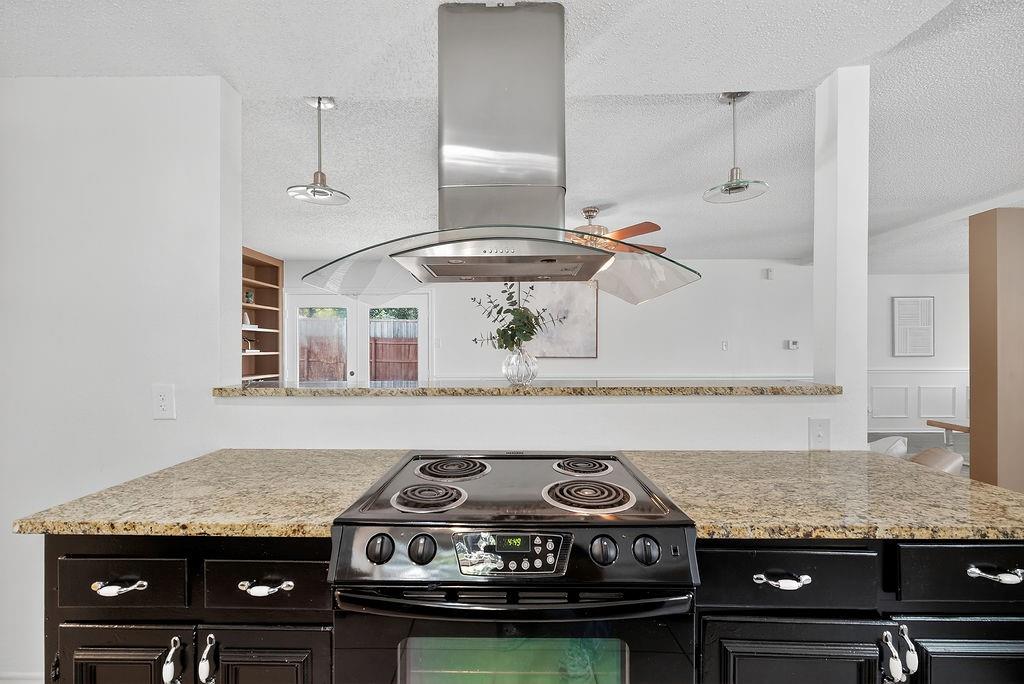9662 Ferndale Road Dallas, TX 75238 - Photo 16 of 39 a stove top oven sitting inside of a kitchen