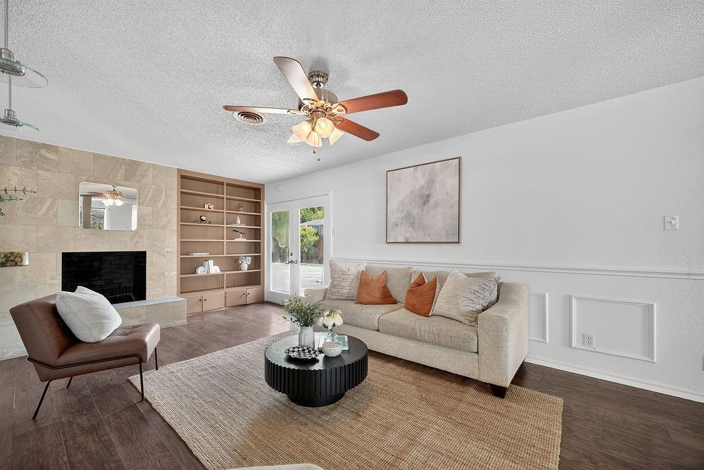 9662 Ferndale Road Dallas, TX 75238 - Photo 20 of 39 a living room with furniture a fireplace and a potted plant