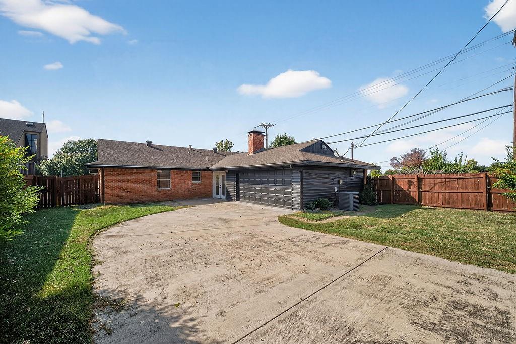 9662 Ferndale Road Dallas, TX 75238 - Photo 38 of 39 a front view of a house with a yard and garage
