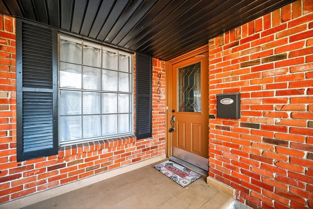 9662 Ferndale Road Dallas, TX 75238 - Photo 4 of 39 a backyard of a house with a large window and outdoor seating