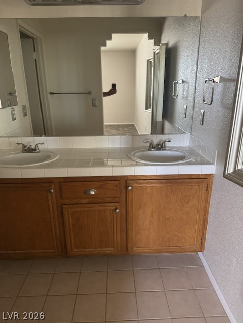 1851 Hillpointe Road, Unit 1412 Henderson, NV 89074 - Photo 5 of 12 Double vanity with ample storage beneath offers functional elegance.