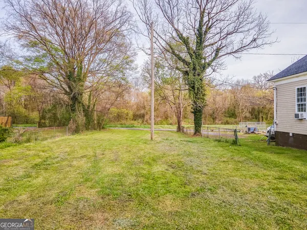 a view of yard with tree and green space